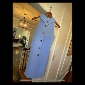 Blue dress with big buttons.